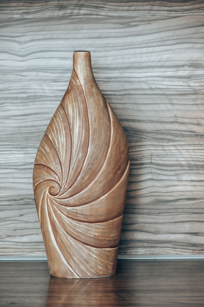 gallery-03 Elegant wooden vase with spiral design, perfect for home decoration and adding rustic charm.